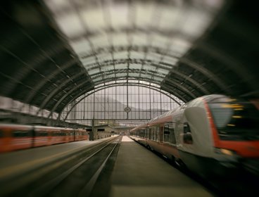 Train passing on rail inside station