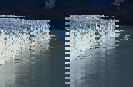 Ice cliff on body of water