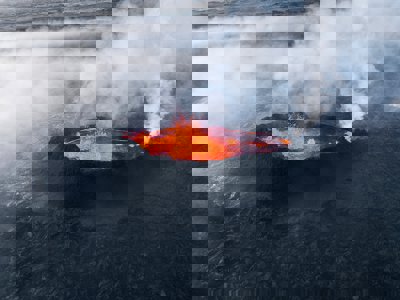 A volcanic crater with lava and gases