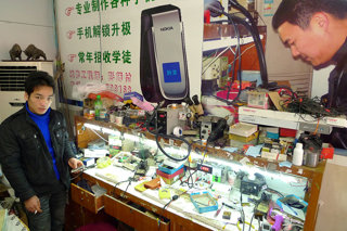 Mobile phone repair workshop in China.