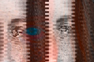 Person with a blue eye close up