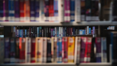 Colourful library books on a shelves.