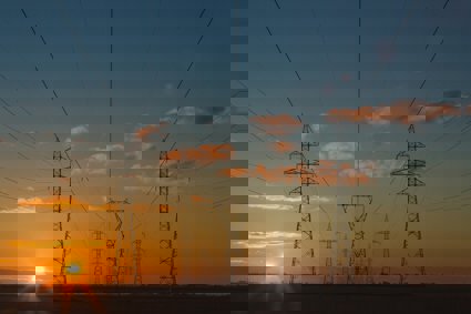 Electricity pylons stretching out into the distance